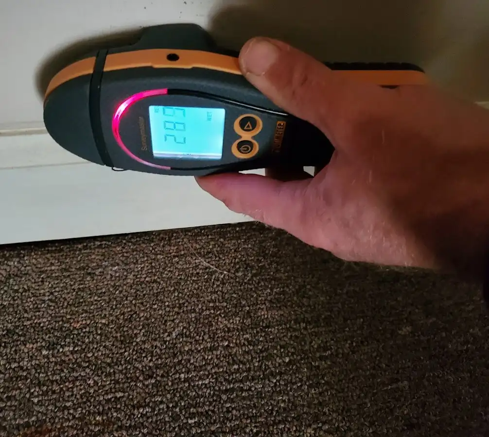 Moisture detection at baseboard during Storm Damage Restoration in Manhattan Beach